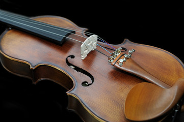 Fototapeta premium Detail of violin on dark background