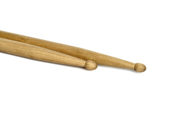 A pair of wooden drumsticks isolated on a white