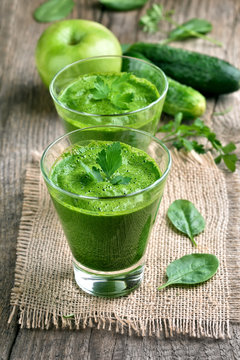 Green smoothie decorated with mint