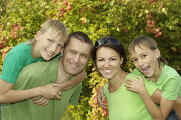 family  walking in the summer park