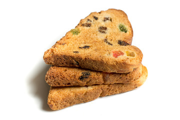three cookies with raisins and candied fruit in the shape of a heart isolated on a white background