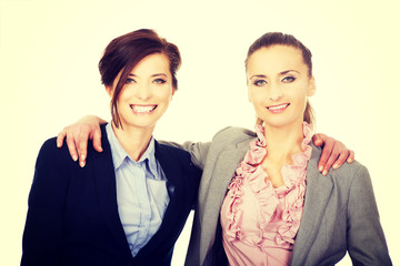 Two women embracing each other.