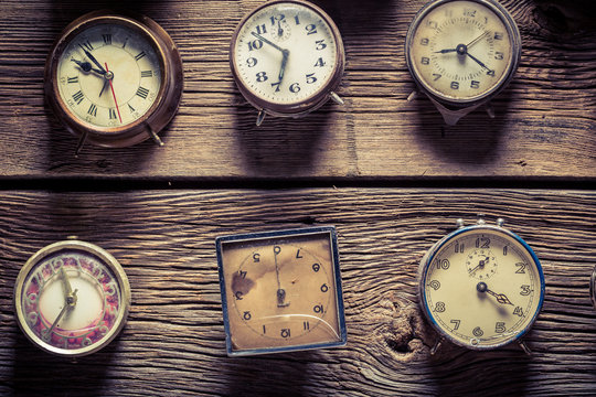 Aged wooden wall with clocks
