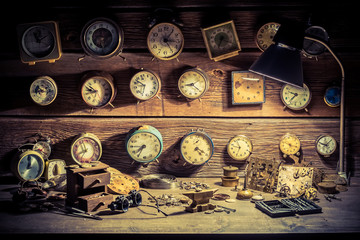 Watchmaker's workshop with damaged clocks