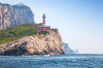 Lighthouse on the rocky coast of Capri island, Italy
