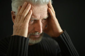 Fototapeta premium Sad senior man at home