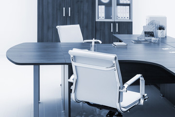 desk and bookcase on white wall