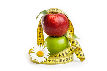 Apples, flowers and measuring tape.