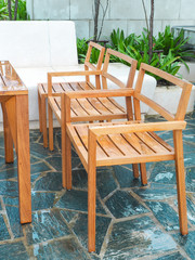Wood chair in resort after rain falling