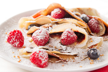 Tasty pancakes with fresh berries