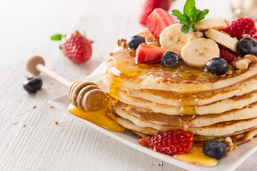Stack of pancakes with fresh berries