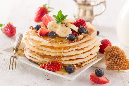 Stack of pancakes with fresh berries