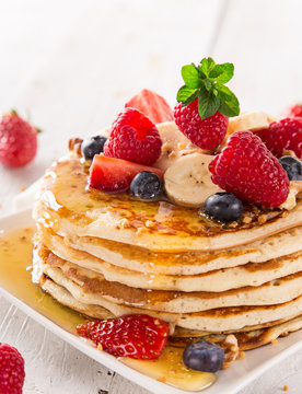 Stack of pancakes with fresh berries