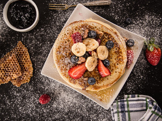 Stack of pancakes with fresh berries