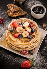 Stack of pancakes with fresh berries