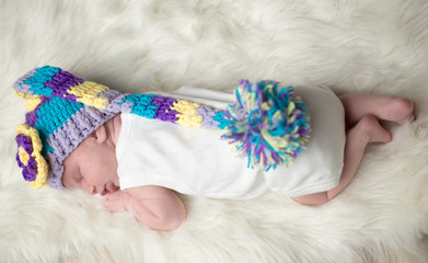 Baby with hat on fur