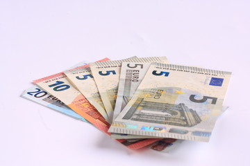 Banknotes of different values on a white background - euro