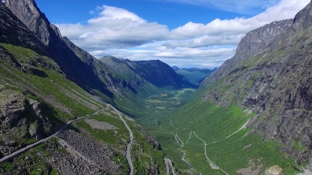 Breathtakingly beautiful road in Trollstigen mountain pass in Norway on sunny summer day. Aerial 4k Ultra HD.