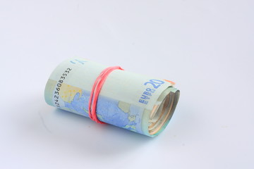 Wad of money with a red rubber band - euro