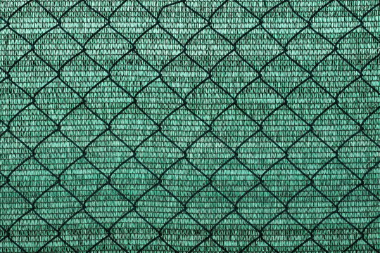 abstract plastic net texture for green background, with shadow wired fence