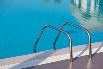 Fototapeta na wymiar Ladder of a swimming pool