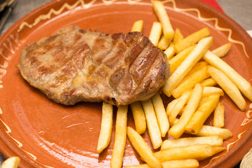 Served beef steak with french fries