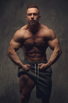 Bodybuilder showing his muscular torso.