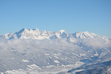 Fototapeta na wymiar Peaks and Valley in Alps in winter.