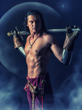 half naked  warrior with a sword in the mystic background