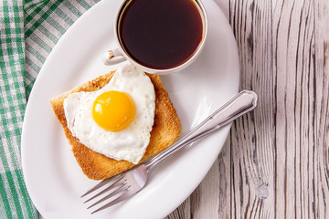 fried egg with toast on a plate