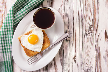 fried egg with toast on a plate