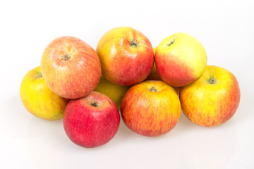 Ripe juicy apples on a white background, harvest from the garden, apple diet to slim figure, vitamin dessert