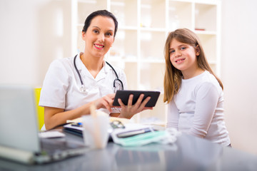 Female doctor and little girl patient.  Medical examination.