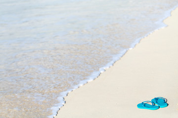 Flip flops on a tropical beach
