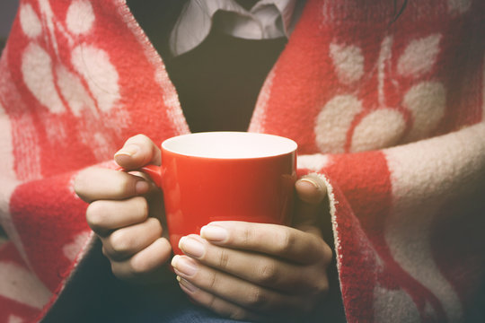 woman and tea and blanket