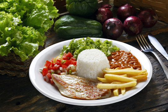 rice, beans, meat, chips and salad