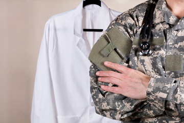 Medical military doctor with medical jacket in background