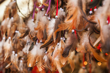 Close up of authentic dreamcatchers with feathers and beads