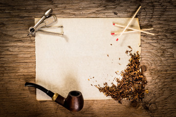 Pipe, old paper and tobacco