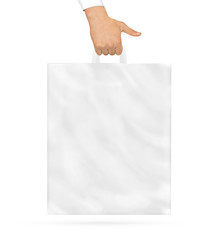 Blank plastic bag mock up holding in hand. Empty polyethylene packaging.