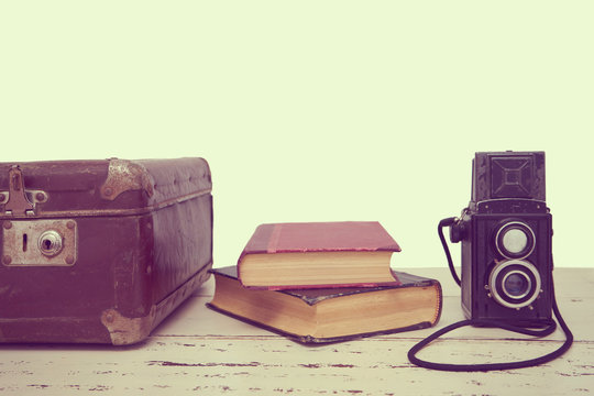 Vintage suitcases with books and camera