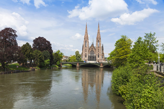 Picturesque view of St. Paul church and Ill river in Strasbourg,