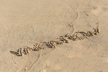 Inscription Vacation on sandy beach