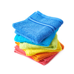 Pile of rainbow colored towels isolated