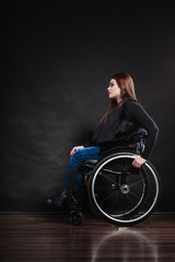 Obraz na płótnie Canvas Sad woman sitting on wheelchair