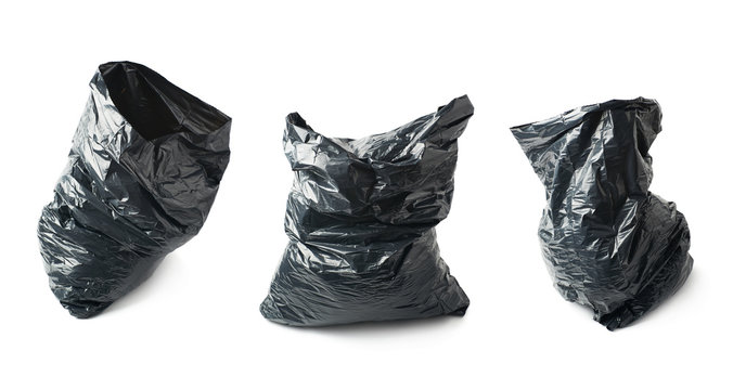 Filled black plastic garbage bag isolated