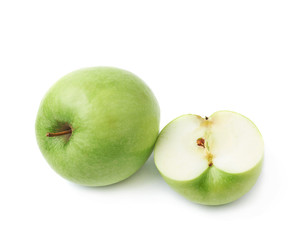 Green apple next to a slice isolated