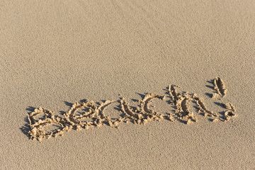 Fototapeta na wymiar Inscription Beach! on sand