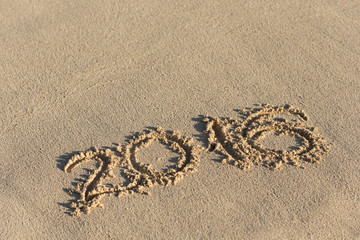 Inscription 2016 on sandy beach