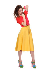 Beautiful woman with curly hair wearing a red jacket, isolated on white background